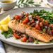 Baked salmon topped with fresh tomato and Kalamata olive relish