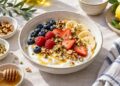 Greek-style yogurt breakfast bowl with berries, banana, walnuts and pistachios